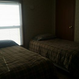 Double bed sleeping accommodations at Oahe Wings & Walleyes